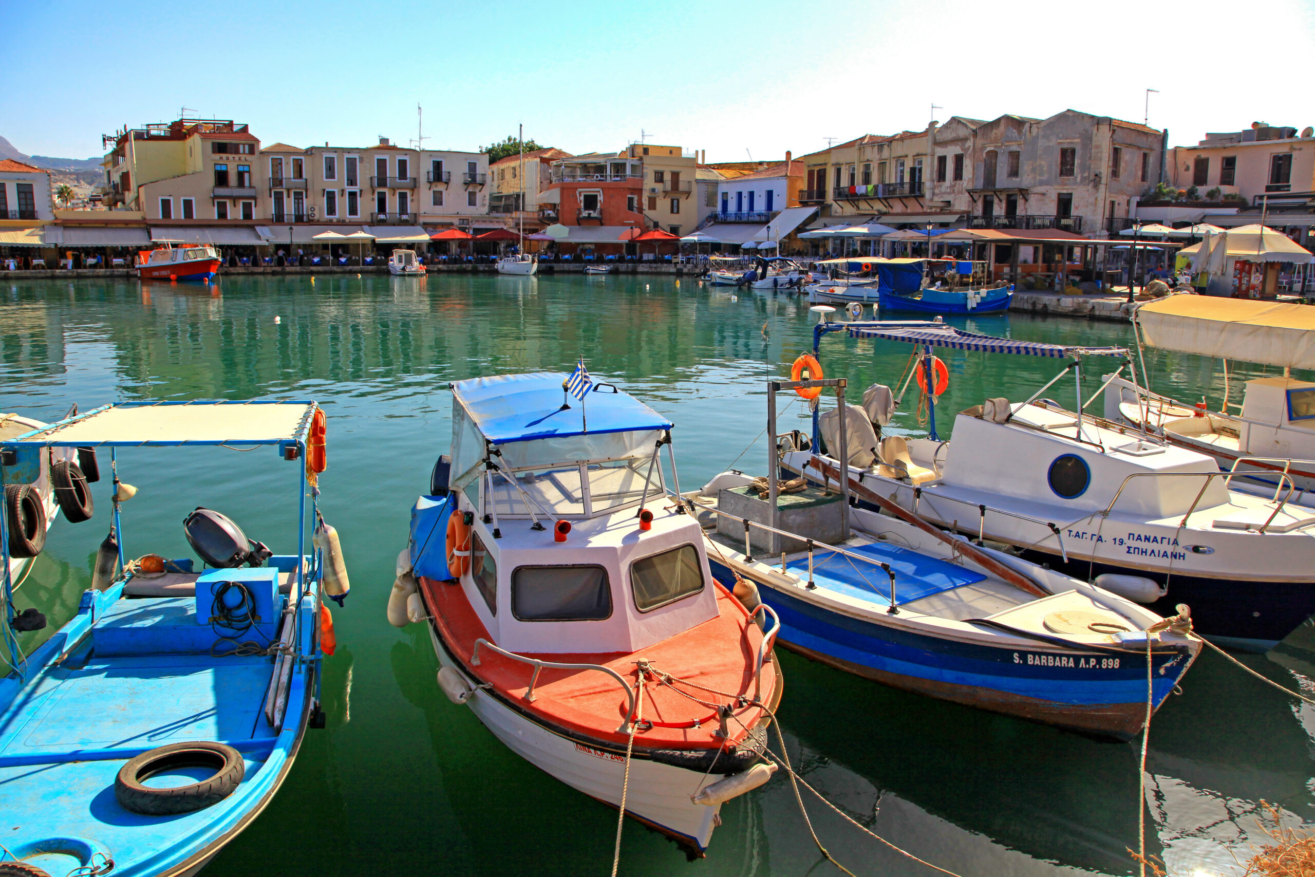 fishing boats in port at town rethymno in crete island at greece