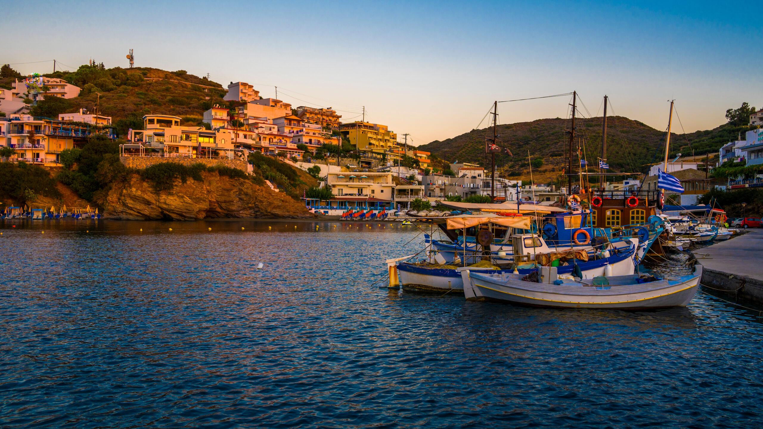 greece, crete, bali, boats moored in town marina at dawn